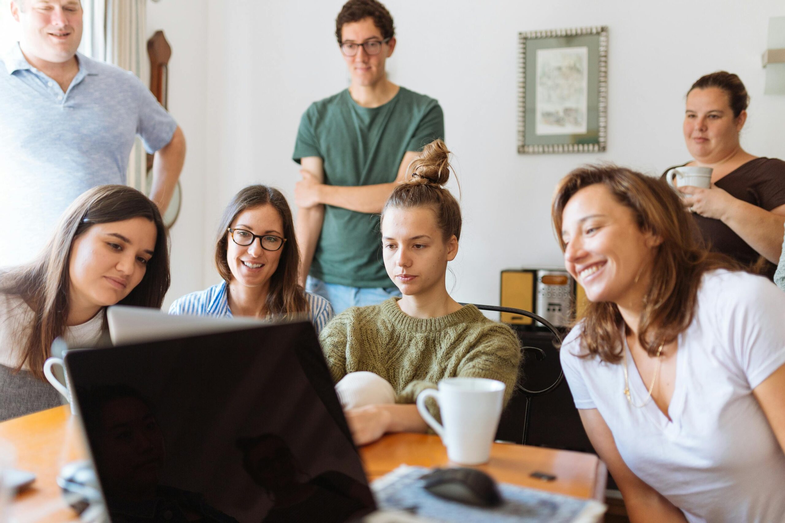 People looking at laptop computer